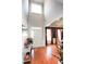 Bright foyer with a soaring ceiling, hardwood floors, and a classic front door with sidelights at 3406 Ravensworth Nw Trce, Kennesaw, GA 30144