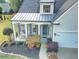 Close-up aerial of the front porch with decorative columns and landscaping at 3406 Ravensworth Nw Trce, Kennesaw, GA 30144