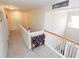 Upstairs hallway with carpet and a decorative blanket rack at 3406 Ravensworth Nw Trce, Kennesaw, GA 30144