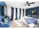 Spacious main bedroom features a tray ceiling, accent wall, lots of natural light and modern decor at 3406 Ravensworth Nw Trce, Kennesaw, GA 30144
