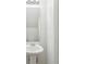 Bright half bathroom features vanity sink, white walls at 4001 Avalon Sw Rd, Atlanta, GA 30331