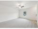 Bright bedroom featuring neutral carpeting, ceiling fan, and natural light at 4001 Avalon Sw Rd, Atlanta, GA 30331
