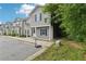 Traditional style gray townhouse with black shutters, covered porch and basketball hoop at 4001 Avalon Sw Rd, Atlanta, GA 30331