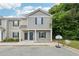 Charming two-story townhome featuring a covered entryway and well-maintained landscaping at 4001 Avalon Sw Rd, Atlanta, GA 30331