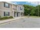 Inviting townhome with covered porch entry, well-manicured landscaping, and ample parking at 4001 Avalon Sw Rd, Atlanta, GA 30331