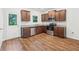 Kitchen with stainless steel appliances, granite countertops and dark wood cabinets offers both style and functionality at 4001 Avalon Sw Rd, Atlanta, GA 30331
