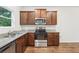 Kitchen features stainless appliances, granite countertops, and wooden cabinets at 4001 Avalon Sw Rd, Atlanta, GA 30331