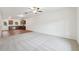 Open-concept living room featuring plush carpeting and an adjoining kitchen area at 4001 Avalon Sw Rd, Atlanta, GA 30331