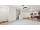 Spacious living room featuring stairs, ceiling fan, and adjoining kitchen area at 4001 Avalon Sw Rd, Atlanta, GA 30331