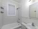 Bright bathroom with white fixtures and a window providing natural light at 242 12Th Ne St # 8, Atlanta, GA 30309