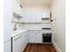 Well-lit kitchen featuring white cabinets, stainless steel oven, and light countertops at 242 12Th Ne St # 8, Atlanta, GA 30309