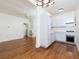 Bright kitchen features white cabinets, modern appliances, and hardwood floors at 242 12Th Ne St # 8, Atlanta, GA 30309
