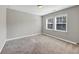 Spacious bedroom with neutral walls and carpet, featuring two large windows at 5386 Bluestone Cir, Mableton, GA 30126