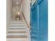 Bright staircase with hardwood steps, blue front door, and white risers at 370 Thrasher St # 2, Norcross, GA 30071