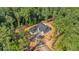 Stunning aerial view of the modern farmhouse-style home nestled in a lush, wooded lot at 107 Marks Way, Canton, GA 30115
