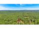 Expansive wooded lot features a prominent pin location indicator amidst lush greenery and distant mountain views at 107 Marks Way, Canton, GA 30115