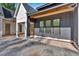 Modern farmhouse exterior showcasing grey board and batten, black window frames, and a side entry at 107 Marks Way, Canton, GA 30115