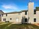The backyard of a two-story house with green grass and blue sky in the background at 6260 Selborn Sw Dr, Atlanta, GA 30331