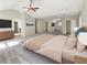 Spacious main bedroom featuring a ceiling fan, walk-in closet, and ensuite bathroom access at 6260 Selborn Sw Dr, Atlanta, GA 30331