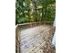 Inviting wooden back deck surrounded by lush trees, perfect for outdoor relaxation at 3370 Knighton Rdg, Powder Springs, GA 30127