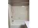 Bathroom featuring white tiles and a shower head, creating a clean and bright space at 3370 Knighton Rdg, Powder Springs, GA 30127