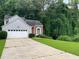 Charming split-level home with well-manicured lawn and two-car garage at 3370 Knighton Rdg, Powder Springs, GA 30127