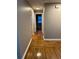 Hallway featuring hard wood floors, neutral paint, and good natural light at 3370 Knighton Rdg, Powder Springs, GA 30127