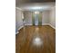 Spacious living room with hardwood floors, neutral paint, and bright windows at 3370 Knighton Rdg, Powder Springs, GA 30127