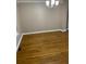 Bright living room with a large window and gleaming hardwood floors at 3370 Knighton Rdg, Powder Springs, GA 30127