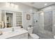 Modern bathroom with white vanity and a large walk-in shower at 27303 Plantation Ne Dr, Atlanta, GA 30324