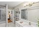 Elegant bathroom with marble tile, a large vanity, and a walk-in shower at 27303 Plantation Ne Dr, Atlanta, GA 30324