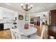 Open dining room with view of kitchen and living room at 27303 Plantation Ne Dr, Atlanta, GA 30324