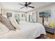 Main bedroom with a king-size bed and access to a balcony at 27303 Plantation Ne Dr, Atlanta, GA 30324