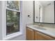 Simple bathroom with light wood cabinets and granite countertop at 4599 Park Dr, Pine Lake, GA 30083