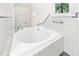 Bathroom featuring a large, free-standing bathtub at 4599 Park Dr, Pine Lake, GA 30083