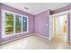 Spacious bedroom with large windows and purple walls at 4599 Park Dr, Pine Lake, GA 30083