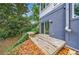 Charming deck with built-in bench overlooking a private backyard at 4599 Park Dr, Pine Lake, GA 30083