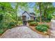 Two-story home with screened porch and landscaped yard at 4599 Park Dr, Pine Lake, GA 30083