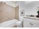 Cozy bathroom with neutral tile, a shower/tub combo and modern fixtures at 4853 Stonehall Pl, Atlanta, GA 30339