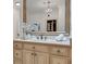 Charming bathroom with a decorative mirror, vanity and a chandelier at 4853 Stonehall Pl, Atlanta, GA 30339