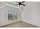 Bedroom with large window providing ample natural light and ceiling fan at 4853 Stonehall Pl, Atlanta, GA 30339