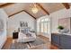 Bedroom showcasing vaulted ceiling, chandelier lighting, and a decorative accent rug at 4853 Stonehall Pl, Atlanta, GA 30339