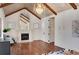 Spacious bedroom with a decorative fireplace, arched mirror, and hardwood flooring at 4853 Stonehall Pl, Atlanta, GA 30339