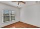 Bright bedroom with wood floors, natural light and blinds at 4853 Stonehall Pl, Atlanta, GA 30339