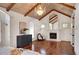 Bright bedroom with hardwood floors, a fireplace, and large arched mirror at 4853 Stonehall Pl, Atlanta, GA 30339