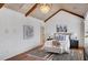 Bright bedroom boasting a vaulted ceiling, elegant chandelier, and hardwood floors at 4853 Stonehall Pl, Atlanta, GA 30339