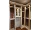 Spacious walk-in closet with custom shelves, rods and mirrored cabinets at 4853 Stonehall Pl, Atlanta, GA 30339