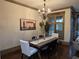 Elegant dining room with hardwood floors and a stylish chandelier at 4853 Stonehall Pl, Atlanta, GA 30339