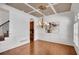 Spacious dining room with hardwood floors, coffered ceilings, and a large chandelier at 4853 Stonehall Pl, Atlanta, GA 30339