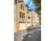 Brick townhomes with multiple garage doors on a paved road at 4853 Stonehall Pl, Atlanta, GA 30339